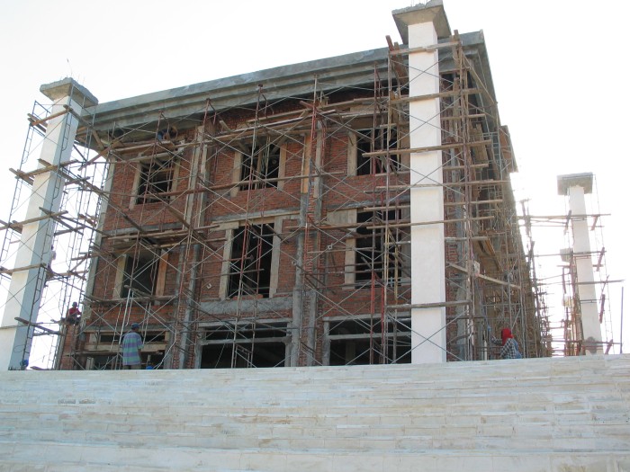 Mall under construction in front of the sea