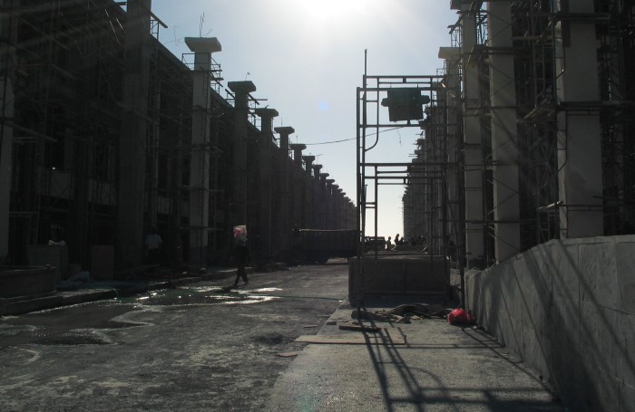 Mall under construction in front of the sea