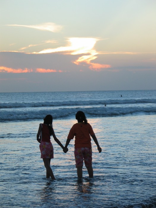 People looking for the sunset into the sea